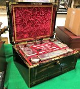 A Victorian coromandel and brass inlaid vanity case, opening to reveal a fitted interior,