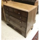 A 19th century oak chest of two short over three long drawers to bracket feet