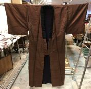 A circa 1960 men's (with cotton stuffing / interlining) winter home kimono with Muji decoration on