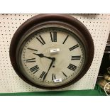 A mahogany cased wall clock of circular form