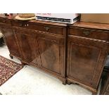 A modern burr walnut veneered breakfront side cabinet in the George III taste,