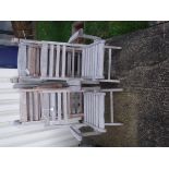 Seven folding teak garden chairs