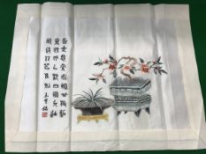 An early 20th Century Chinese silk panel decorated with Bonsai and script