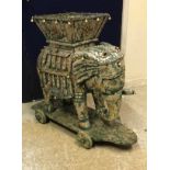 A circa 1900 Indian Rajasthan painted wooden elephant toy with howdah on four solid wooden wheels