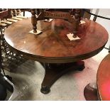 A Victorian mahogany circular breakfast table and a Victorian mahogany secretaire chest of four