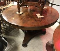A Victorian mahogany circular breakfast table and a Victorian mahogany secretaire chest of four