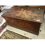 A Victorian stained pine trunk with wrought iron side carrying handles