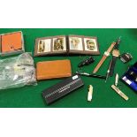 A collection of various miscellaneous items to include watches, Papermate pens, penknives, coins,