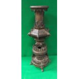 A late 19th Century Japanese Meiji period patinated bronze temple type vase in various sections