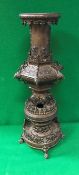 A late 19th Century Japanese Meiji period patinated bronze temple type vase in various sections