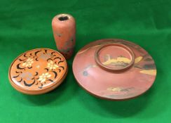 An early 20th Century Japanese lacquered lidded bowl, the top with landscape decoration,