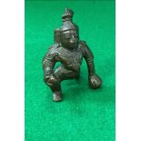A Chola bronze figure of baby Krishna crawling with a butter ball in hand