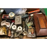 A box containing assorted items to include a carriage clock, a small mohair Schuco style bear,