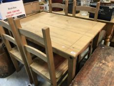 A modern pine kitchen table and four chairs