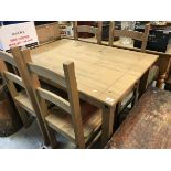 A modern pine kitchen table and four chairs