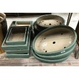 A collection of fourteen Japanese green glazed Bonsai pots of varying sizes - seven oval and seven