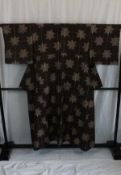 A circa 1950 wool kimono with Momiji (Acer) decoration on a reddy brown ground