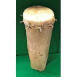 An African treen ware log type tom tom drum with hide cover