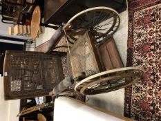 A late Victorian stained beech framed and caned bath chair