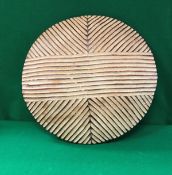 A carved South African Zulu painted treen ware shield with geometric decoration