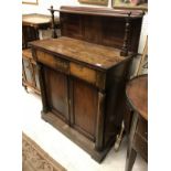 A Regency rosewood chiffonier with shelved superstructure over two drawers and two cupboard doors