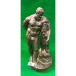 A bronze figure of Hercules leaning on his club