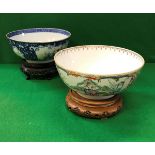 A Chinese famille-rose and blue and white decorated fruit bowl with panels of figures in garden