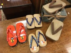 Two pairs of late 20th Century boy's geta (shoes), one with Snoopy design,