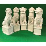 Five 19th Century Chinese blanc-de-chine figures of temple lions,