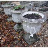 A set of three reconstituted stone planters with acanthus decoration