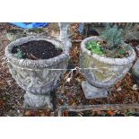 A pair of reconstituted stone planters in the 19th Century manner