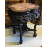 A 19th Century Chinese rosewood and mother of pearl inlaid urn stand with rosso marble top above a