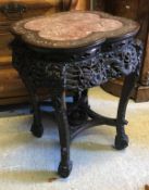 A 19th Century Chinese rosewood and mother of pearl inlaid urn stand with rosso marble top above a