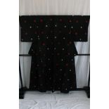 A circa 1960 wool kimono with Kasuri (Japanese check) decoration on a black ground