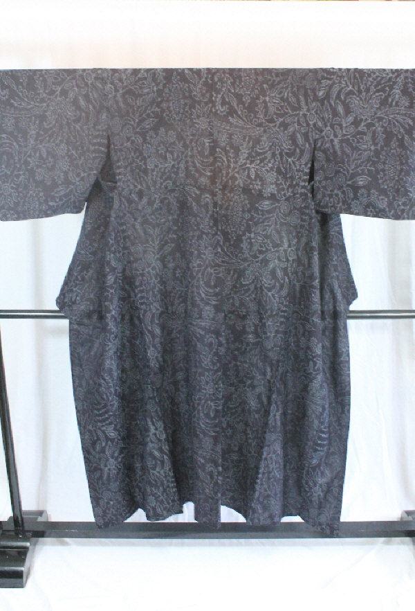 A circa 1960 Tsumugia silk semi-formal kimono with Azami (thistle) pattern on a black ground