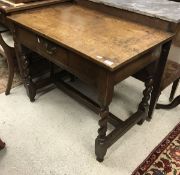 An oak single drawer side table in the 17th Century style,