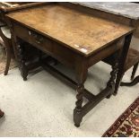 An oak single drawer side table in the 17th Century style,