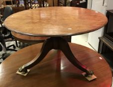 A Regency mahogany tea table, the circular top on a turned pedestal to cabriole tripod base,