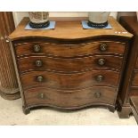A late George III mahogany serpentine fronted chest of four long graduated drawers on bracket feet