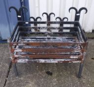 A cast iron fire basket