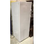 An Indesit upright freezer