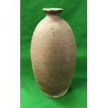 A 19th Century Japanese bizen yaki vase with turned line decoration and incised mark to the