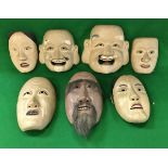 A collection of seven circa 1900 Japanese noh men wooden masks