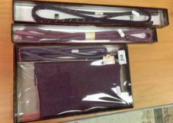 A purple silk obi age and obi shime set (cased),