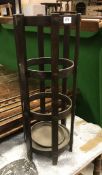 A circa 1900 oak cylindrical stick stand by Liberty bearing label to underside "Liberty,