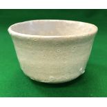 A circa 1920 Japanese shigaraki chawan with white glaze,