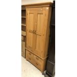 An oak two piece wardrobe