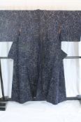 A circa 1960 semi-formal Hakusen silk kimono with Mokuren (Magnolia) design on a dark blue ground