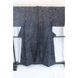 A circa 1960 semi-formal Hakusen silk kimono with Mokuren (Magnolia) design on a dark blue ground