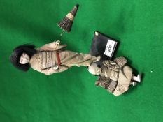 An early 20th Century baby boy samurai figure,